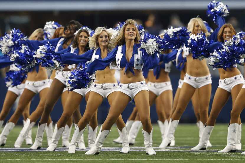 Dallas Cowboys cheerleaders perform before a playoff game between the Dallas Cowboys and...