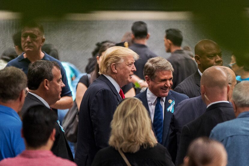 President Donald Trump speaks with Austin congressman Michael McCaul at the National...