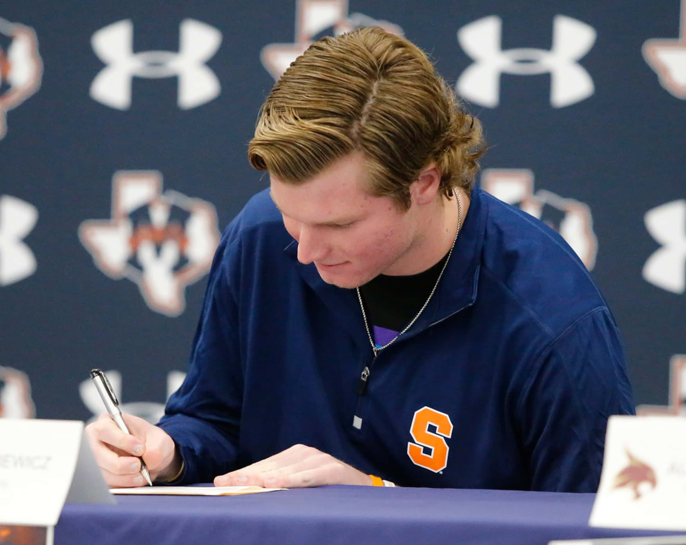 McKinney North quarterback Dillon Markiewicz signs his letter of intent to play for Syracuse...