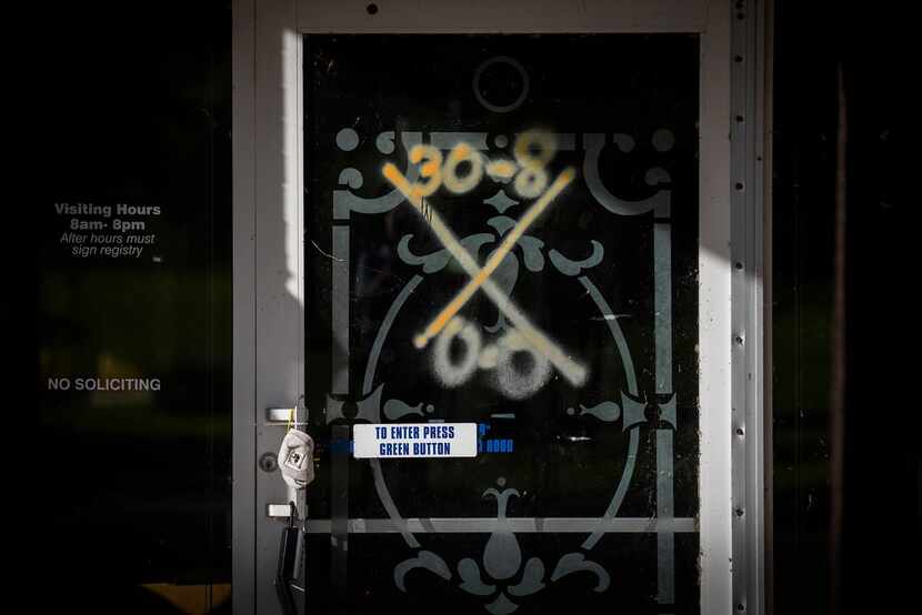 Search and rescue markings can still be seen on the front door of the vacant Cypress Glen...