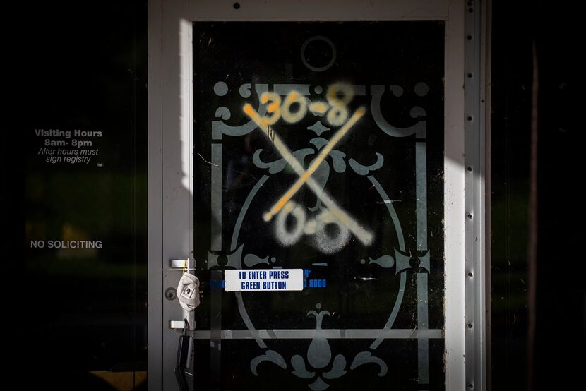 Search and rescue markings can still be seen on the front door of the vacant Cypress Glen...