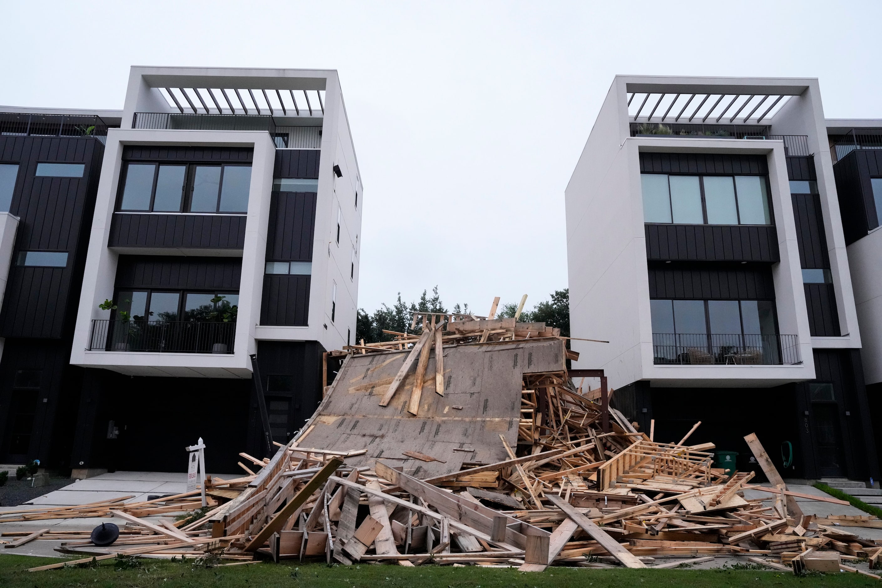 Debris sits in front of a building under construction that collapsed during last night's...