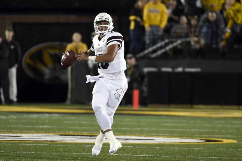 Mississippi State quarterback Dak Prescott throws during the first half of an NCAA college...