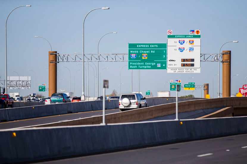 Motorists drive west on LBJ Freeway at one entrance to the TEXpress toll lanes. (File...