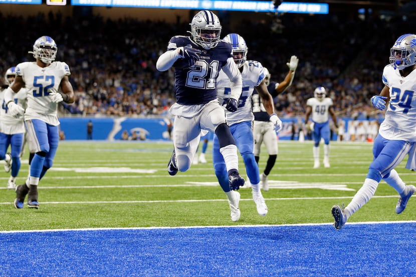 Dallas Cowboys running back Ezekiel Elliott (21) leaps into the end zone for a touchdown as...
