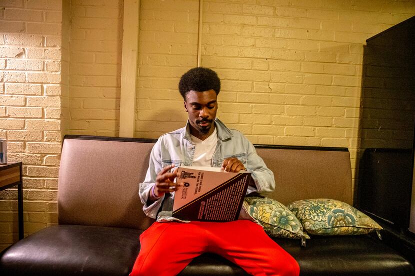 Tye Harris opens his Central Track Music Honor vinyl record at the Granada Theater in...