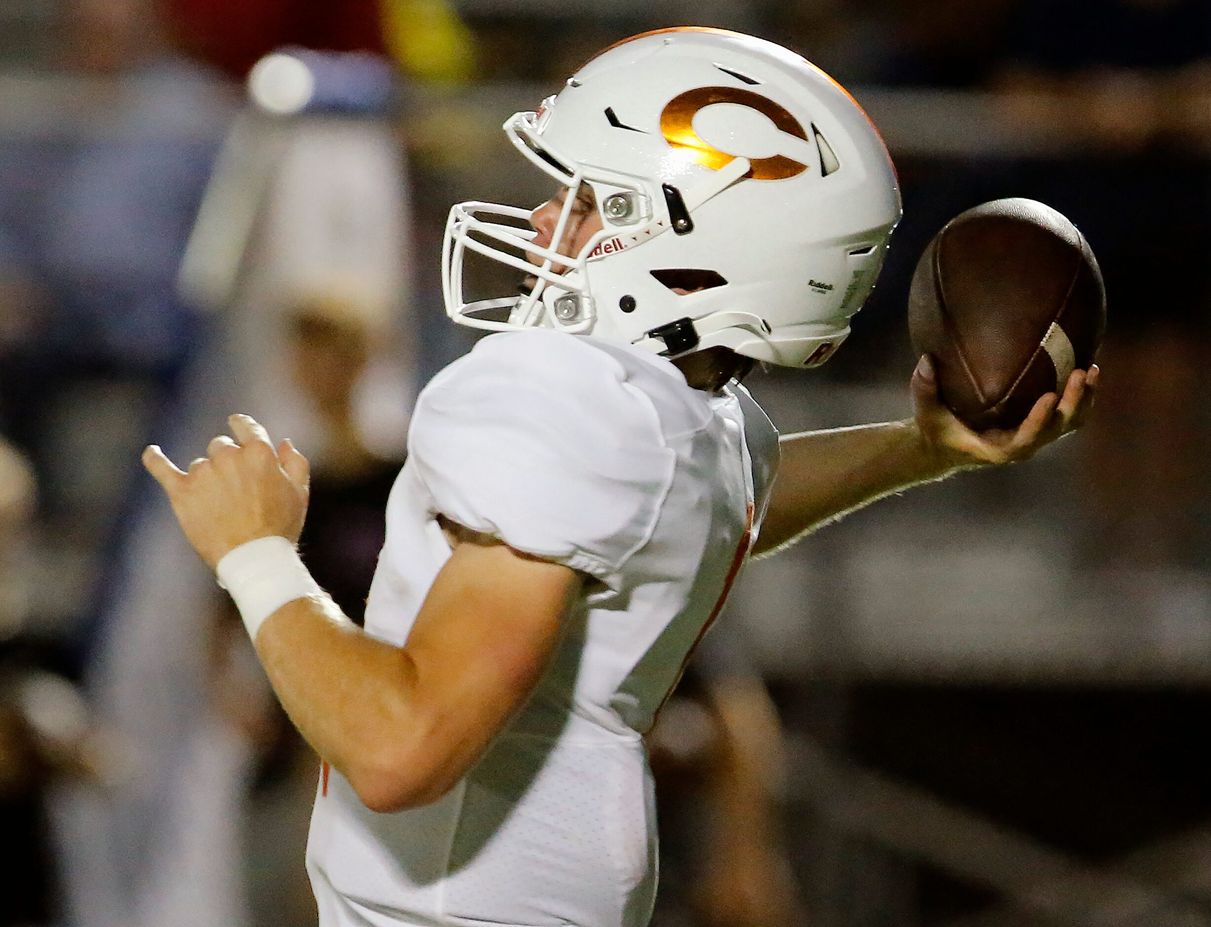 Celina High School quarterback Noah Bentley (1) throws a pass during the first half as...