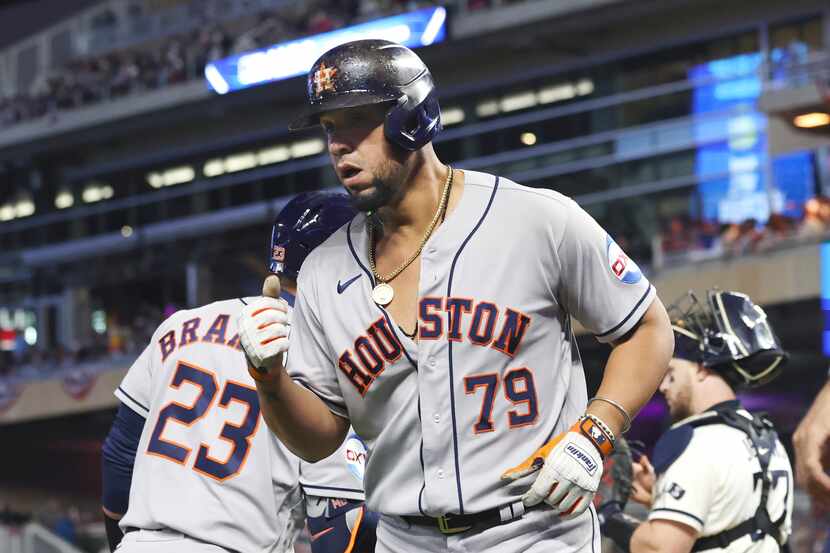 Houston Astros' Jose Abreu reacts after a two-run home run during the fourth inning of Game...