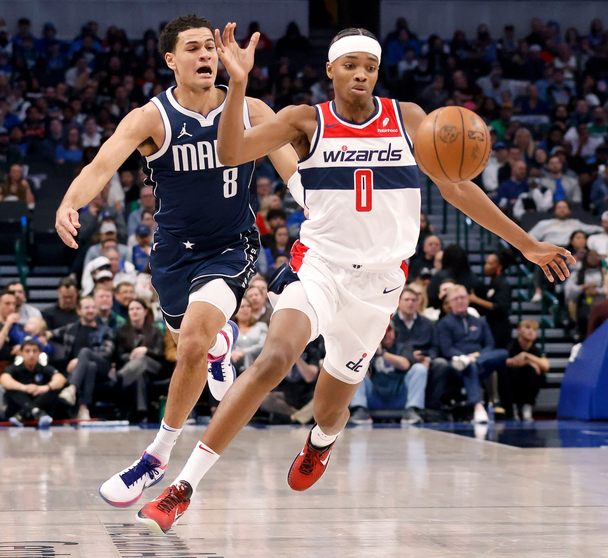 Dallas Mavericks guard Josh Green (8) taps the ball away form Washington Wizards guard Bilal...