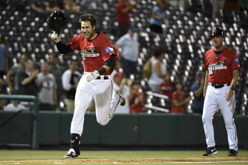 Third baseman Joey Gallo celebrates his three-run home run to win the game against the...