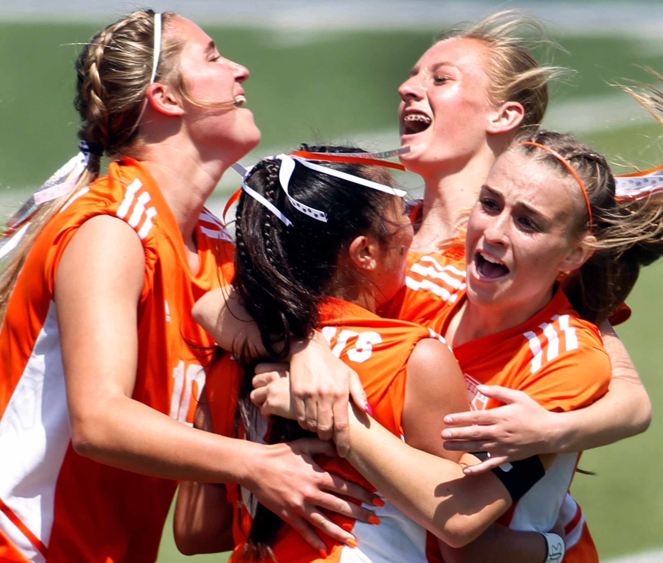 Celina forward Lexi Tuite (7), right, celebrates her first goal with teammates during first...