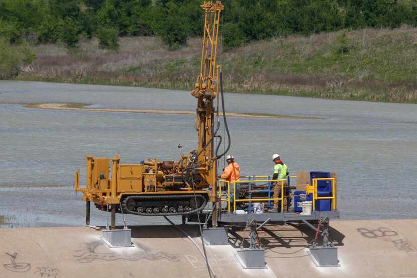 Independent contractors were drilling and testing to see how many new anchors are needed and...
