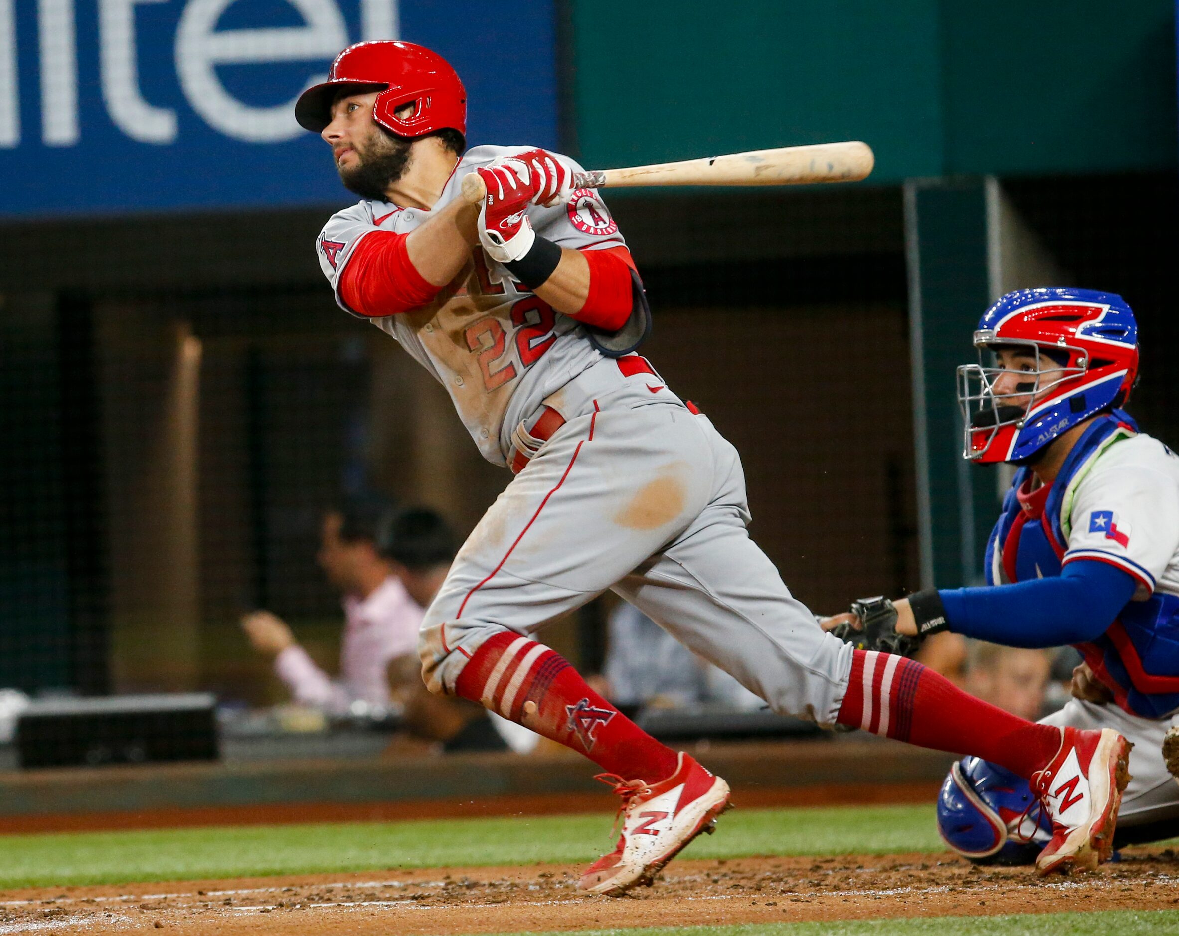 Los Angeles Angels third baseman David Fletcher (22) hits Texas Rangers starting pitcher...