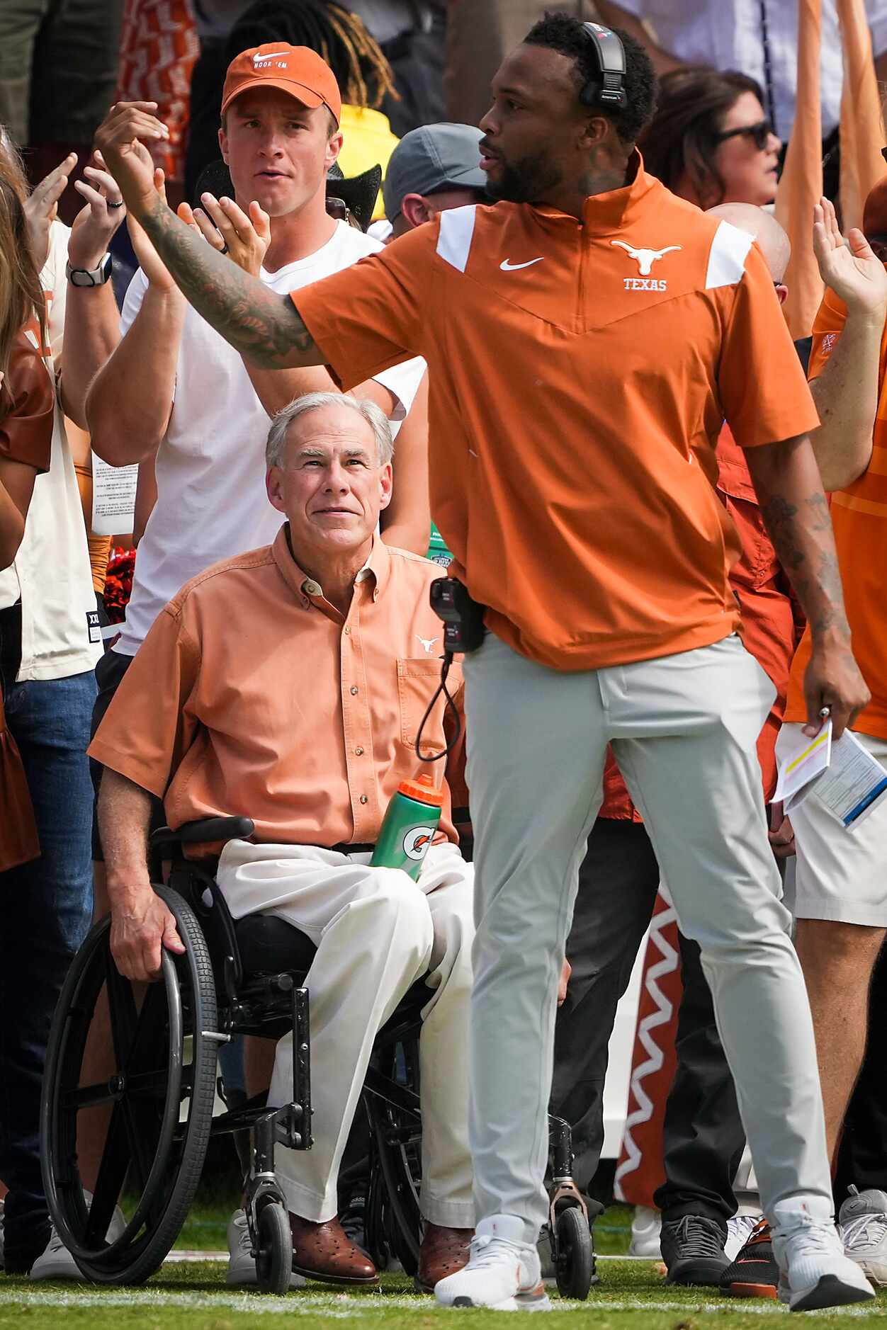 Texas Governon Greg Abbott watches from the sidelines during the first half of the annual...
