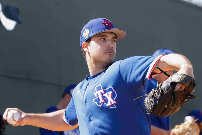 Texas Rangers minor league pitcher Ryan Garcia throws a ball in the bullpen during a spring...