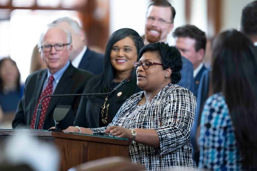 State Rep. Toni Rose, D-Dallas, shows her appreciation of House Speaker Dade Phelan from the...