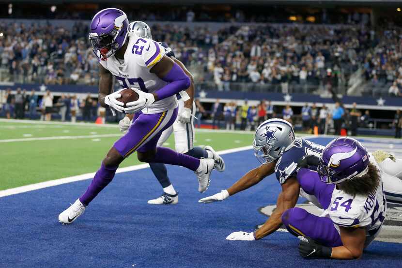 FILE - Vikings safety Jayron Kearse (27) intercepts a pass in the end zone during the second...