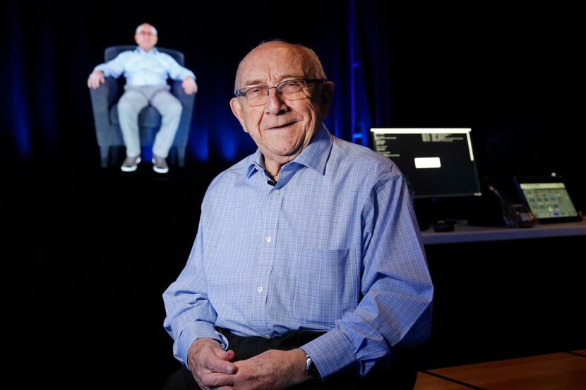 Holocaust survivor Max Glauben poses for a photo before a holographic image of himself in...