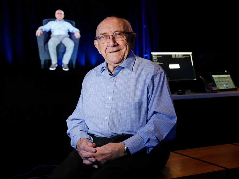 Holocaust survivor Max Glauben poses for a photo before a holographic image of himself in...