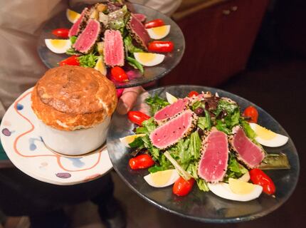 A soufflÃ© and salads enroute to diners at the Inwood Village restaurant Rise SoufflÃ© Salon...