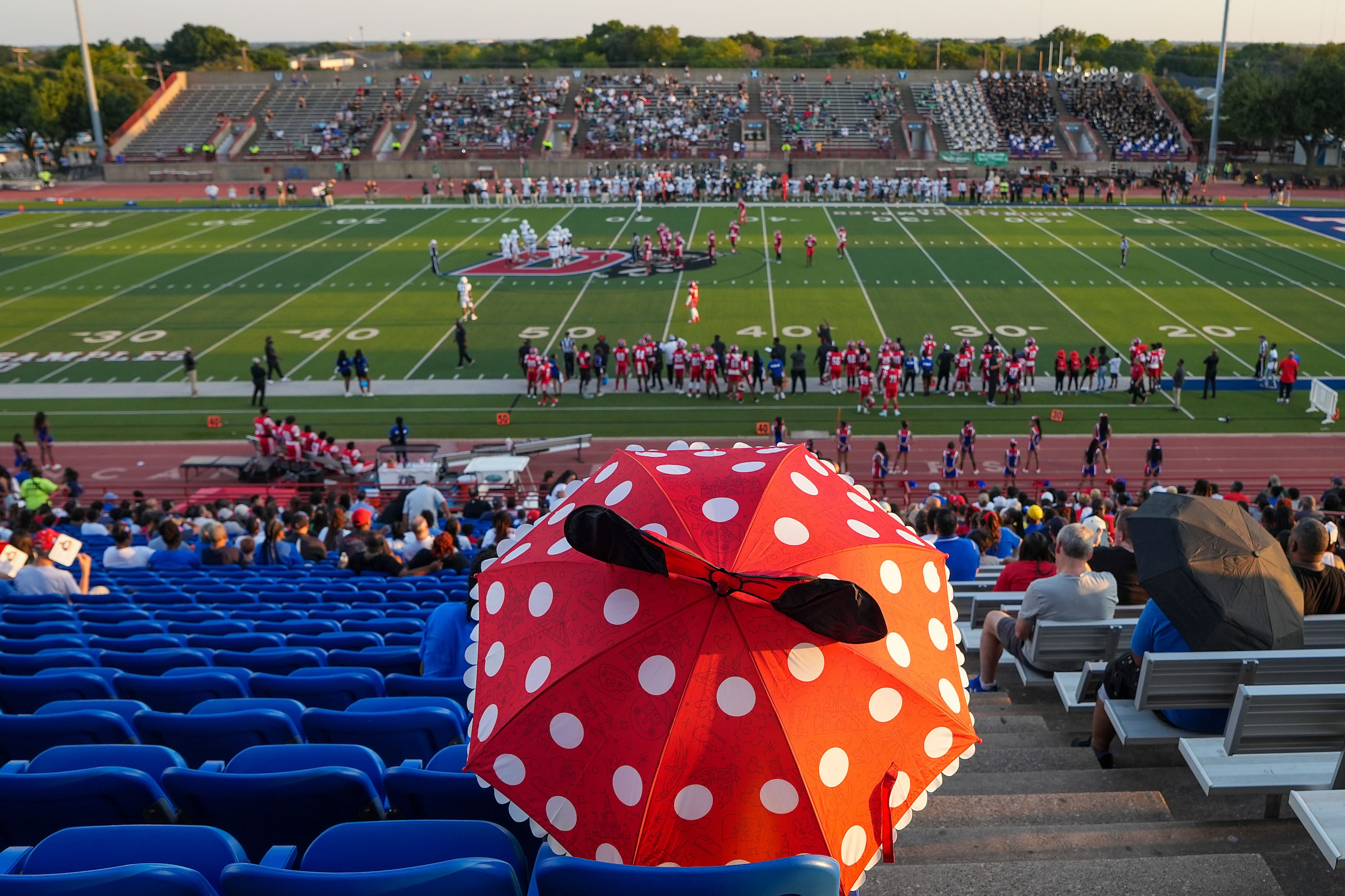 Fans watch during the first half of a District 11-6A high school football game between...