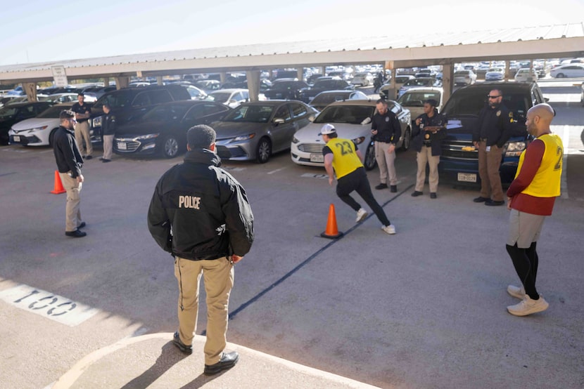 Potential Dallas Police recruits do the Illinois Shuttle Run as part of the Physical...