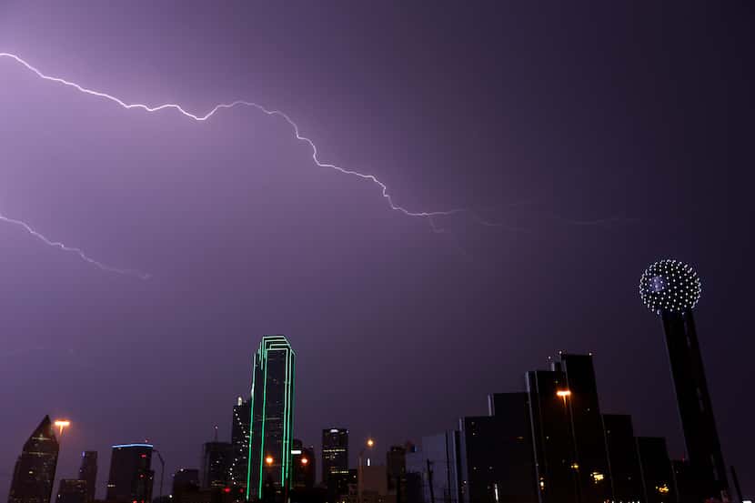 A bolt of lightning strikes over the downtown skyline in Dallas.