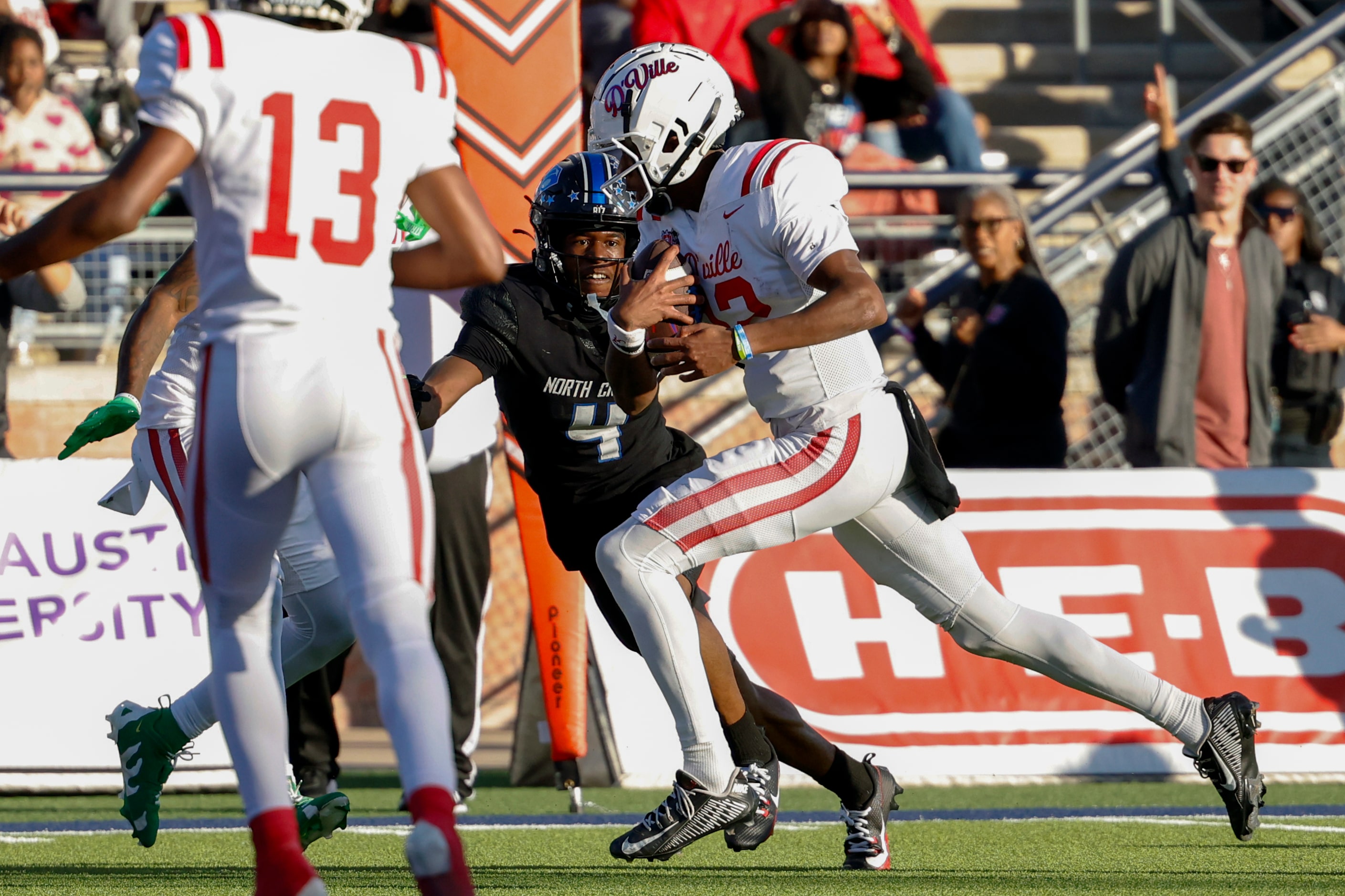 Duncanville quarterback Keelon Russell (12) runs for a touchdown during the first half of a...