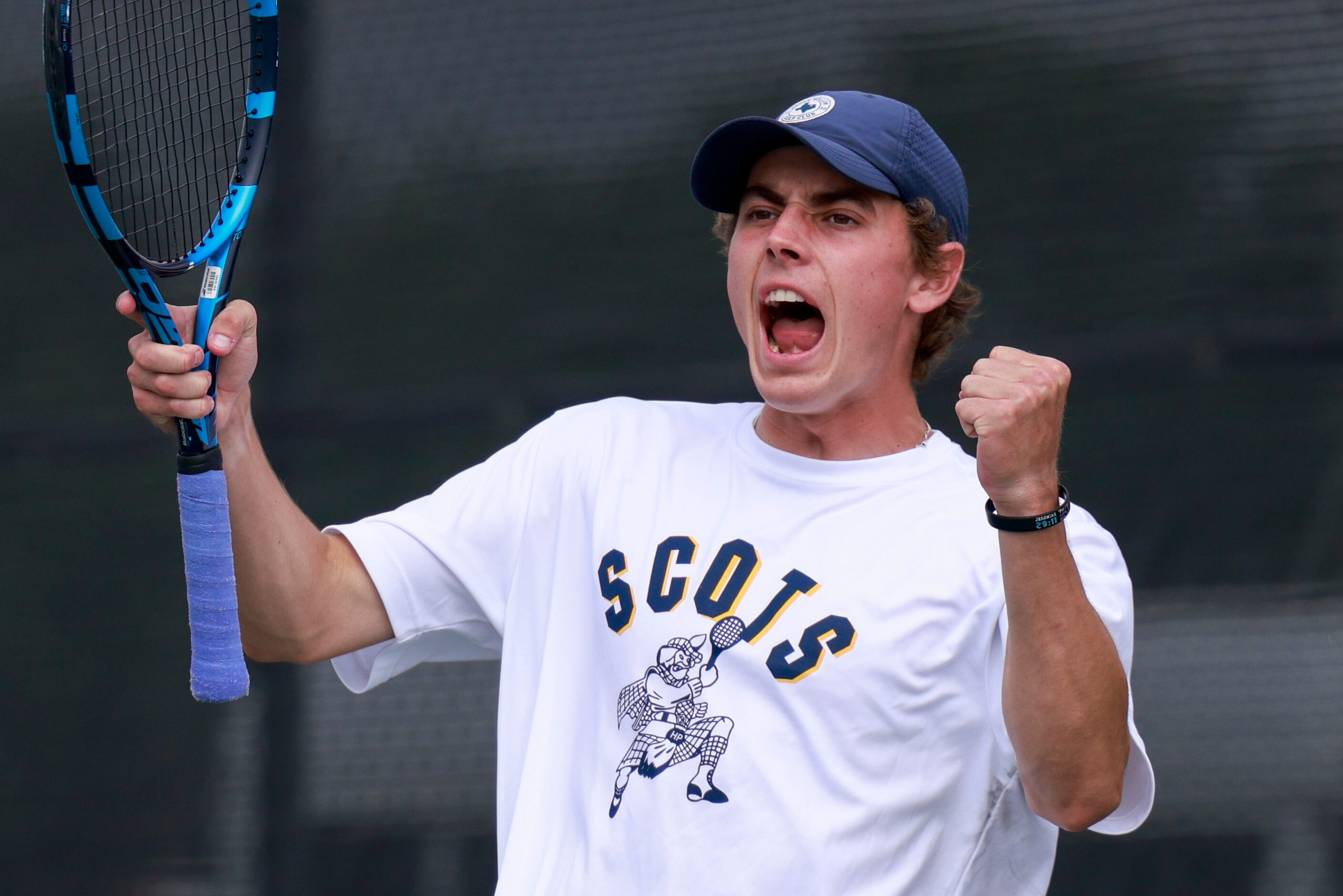 Highland Park’s Ray Saalfield celebrates a point during the 5A boys doubles championship...