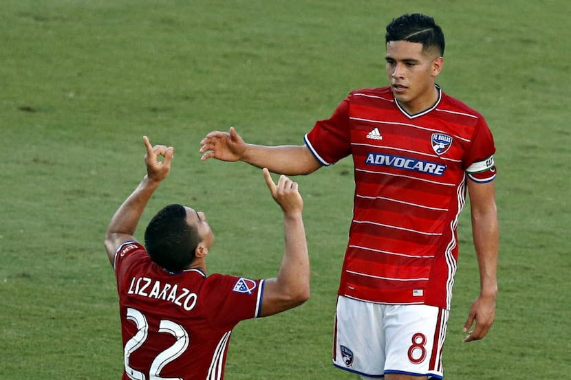 FC Dallas midfielder Carlos Lizarazo (22) and Victor Ulloa celebrate Lizarazo's goal against...