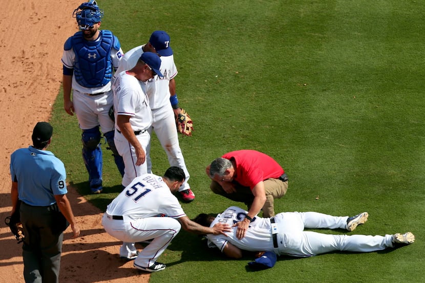 ARLINGTON, TX - AUGUST 20:  Joey Gallo #13 of the Texas Rangers lays on the field after...