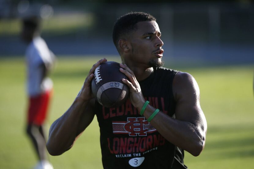 Quarterback Avery Davis runs through drills at Cedar Hill High School in Cedar Hill, Texas ...