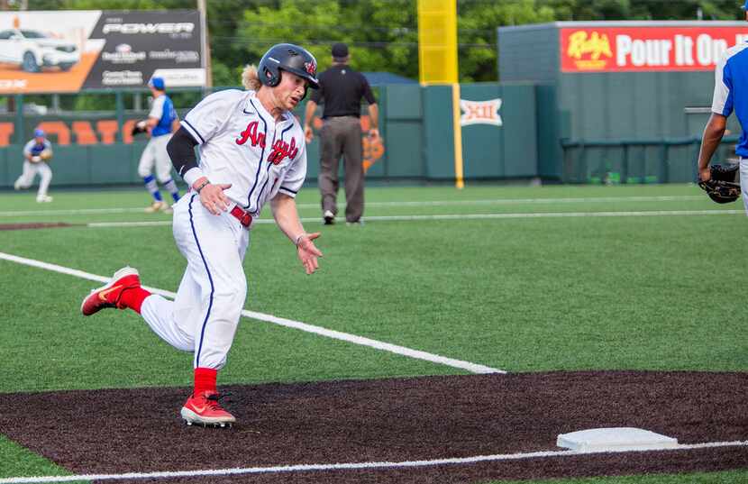 Argyle's senior Dillon Carter (1) makes a run for third base during their game with La...