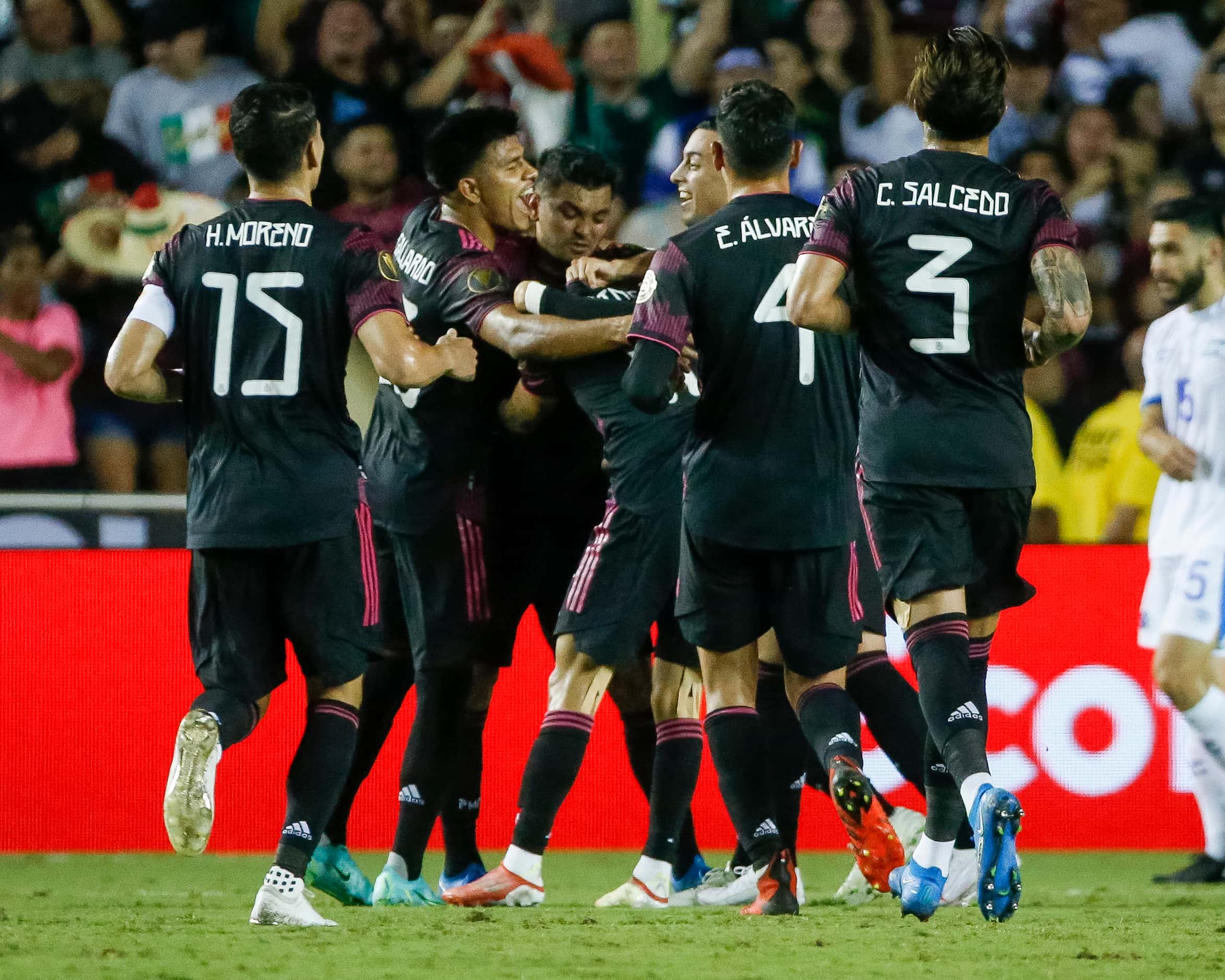 Mexico players celebrate after Mexico defender Luis Rodríguez (21) scored a goal during the...
