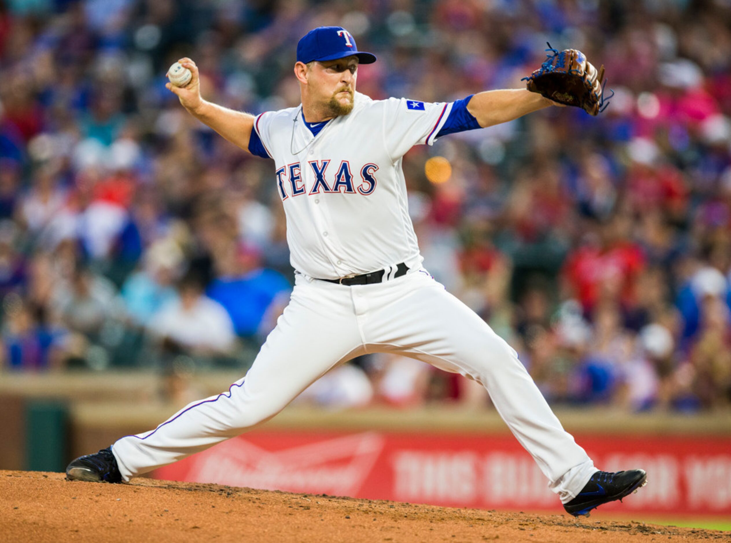 Texas Rangers relief pitcher Austin Bibens-Dirkx (56) pitches during the fifth inning of an...