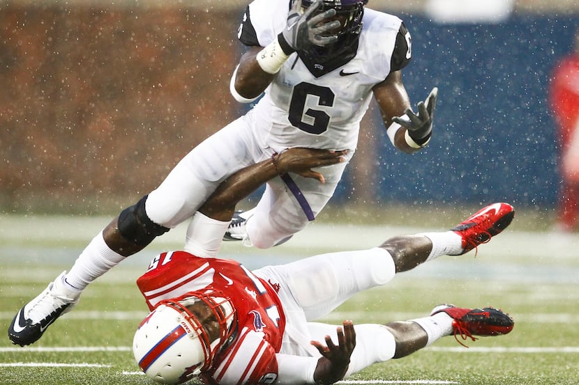 TCU Horned Frogs safety Elisha Olabode (6) breaks up a pass to Southern Methodist Mustangs...
