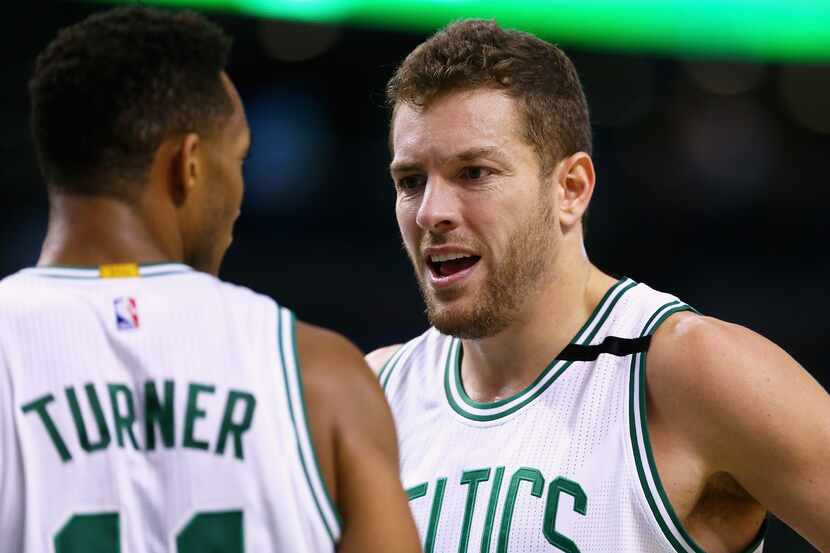 BOSTON, MA - DECEMBER 09: David Lee #42 of the Boston Celtics talks with Evan Turner #11...
