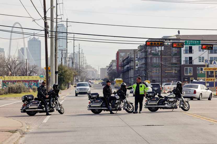 Dallas police officers blocked traffic on Singleton Boulevard responding to a person in...
