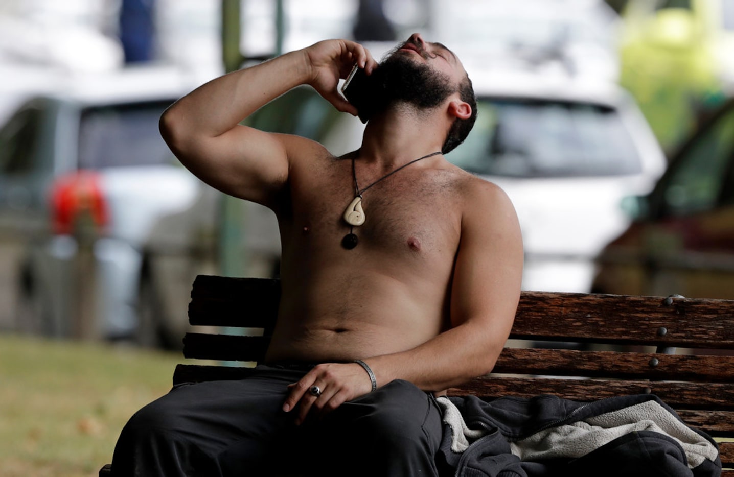 A man reacts as he speaks on a cellphone outside a mosque in central Christchurch, New...