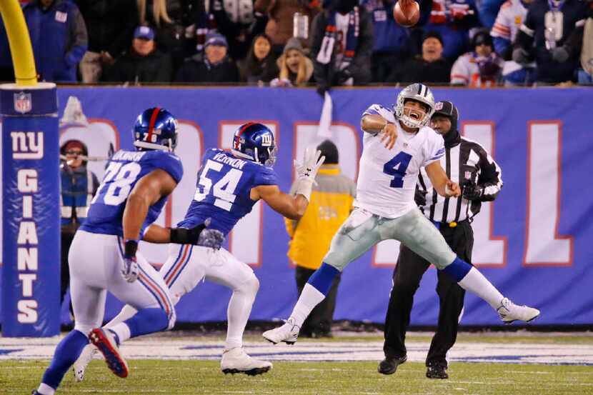 Dallas Cowboys quarterback Dak Prescott (4) gets a pass away under pressure in the fourth...