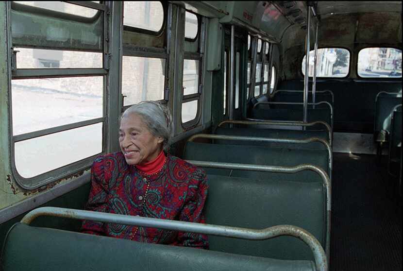  Civil rights pioneer Rosa Parks sits in a 1950s-era bus in Montgomery, Ala., in this Dec....