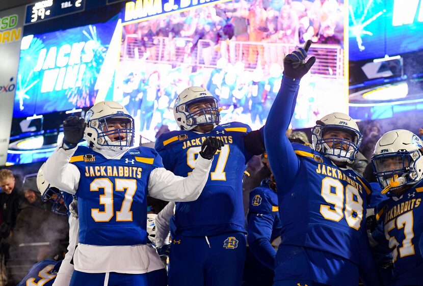 South Dakota State players celebrate beating Montana State during the FCS semifinal NCAA...