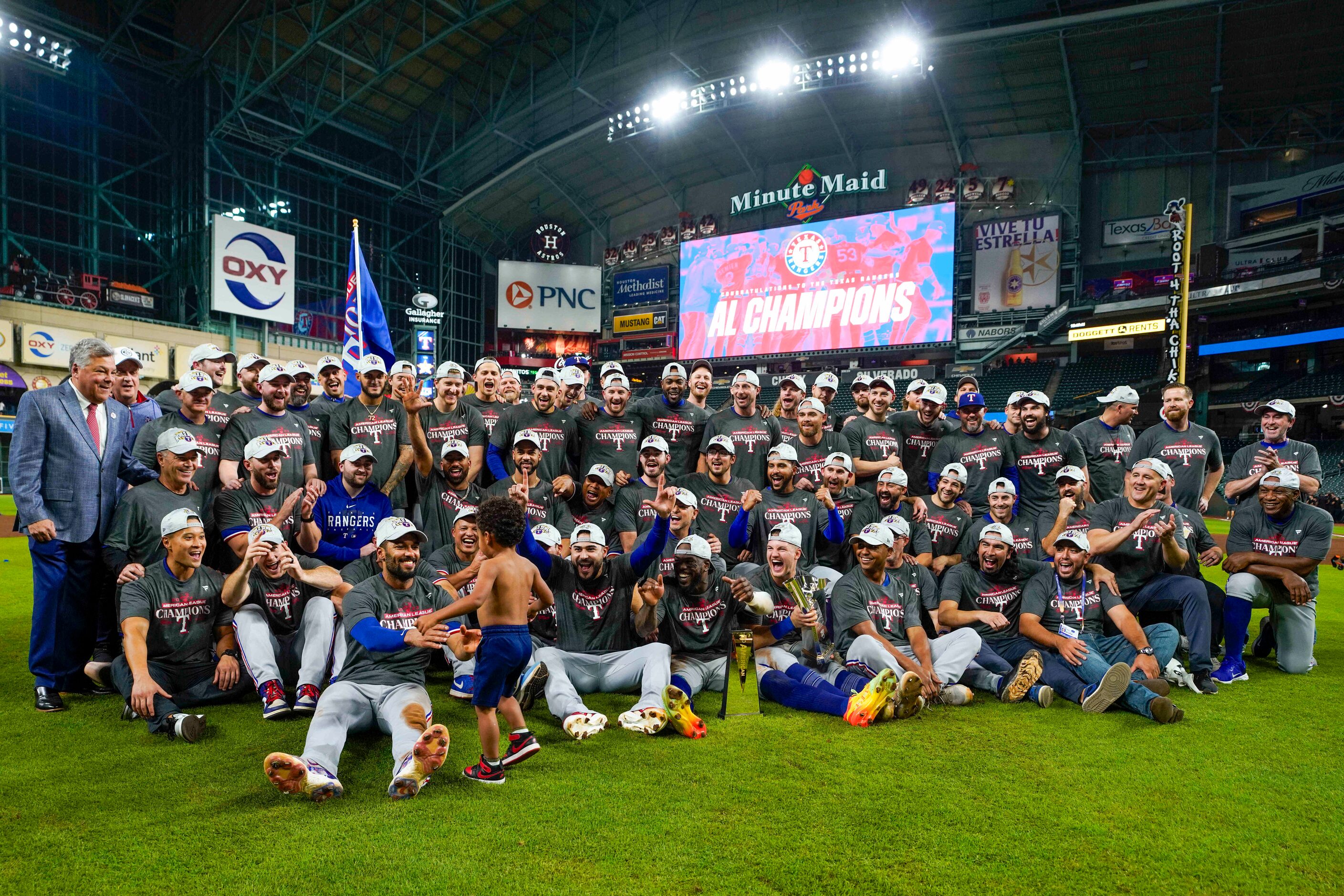 Texas Rangers players gather for a team photo as they celebrate after a victory over the...