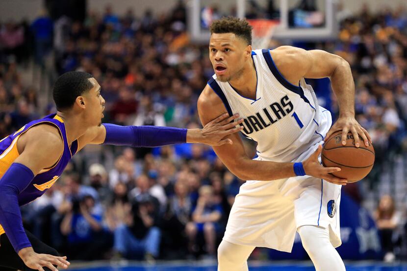 Dallas Mavericks guard Justin Anderson (1) looks past Los Angeles Lakers guard Jordan...