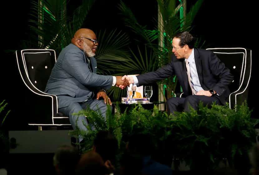 Bishop T.D. Jakes and AT&T Chairman and CEO Randall Stephenson shake hands after talking...