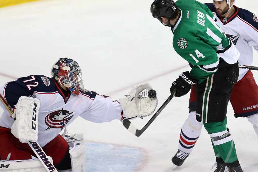 Columbus Blue Jackets goalie Sergei Bobrovsky (72) snags the puck from Dallas Stars left...
