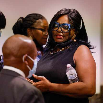 Regina Oliver, mother of Andre Emmett, waits outside the courtroom during the capital murder...