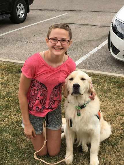 Hannah Westmoreland with her service dog, Journey.