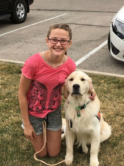 Hannah Westmoreland with her service dog, Journey.