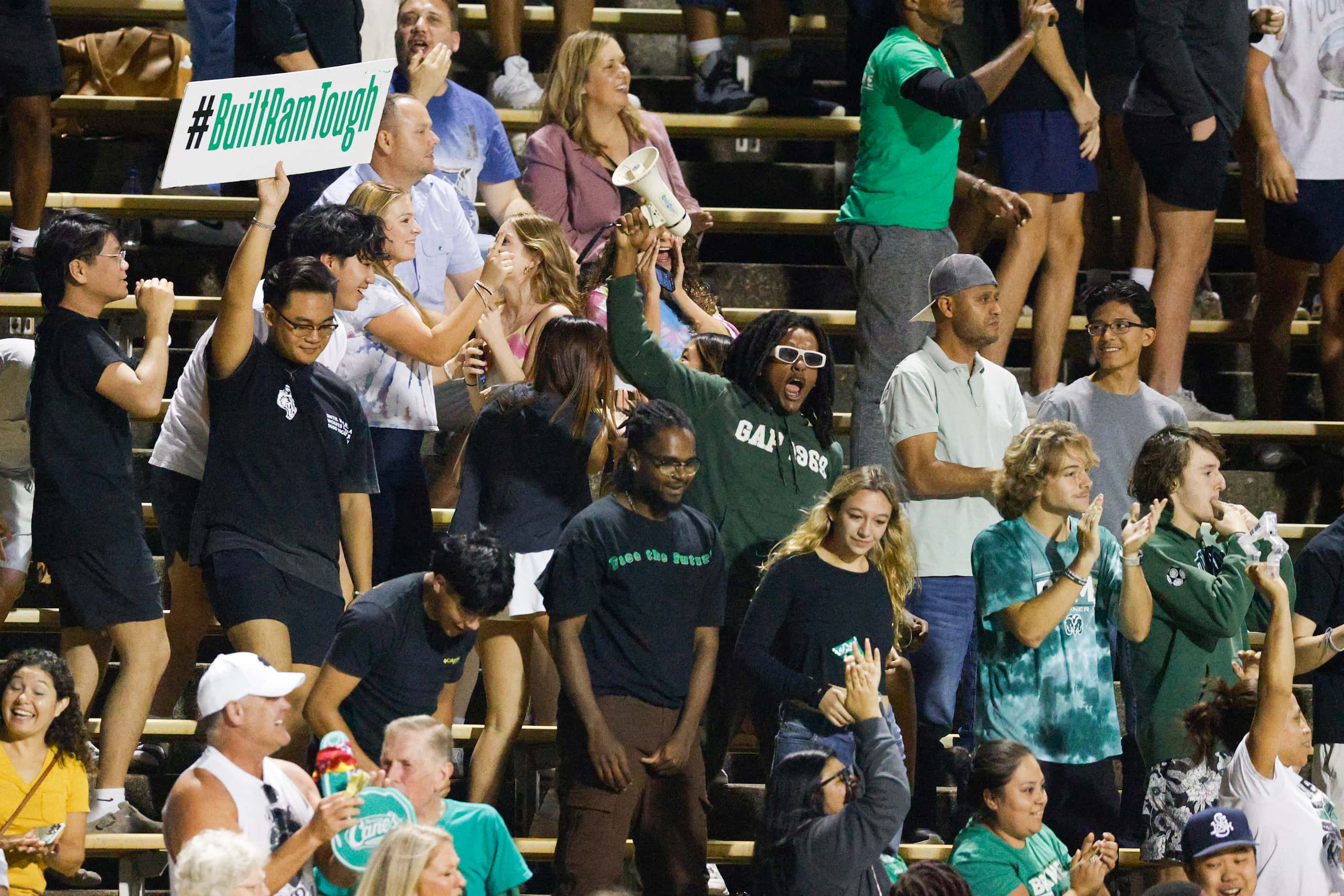 Richardson Berkner fans celebrate a touchdown on a kickoff return during the first half of a...